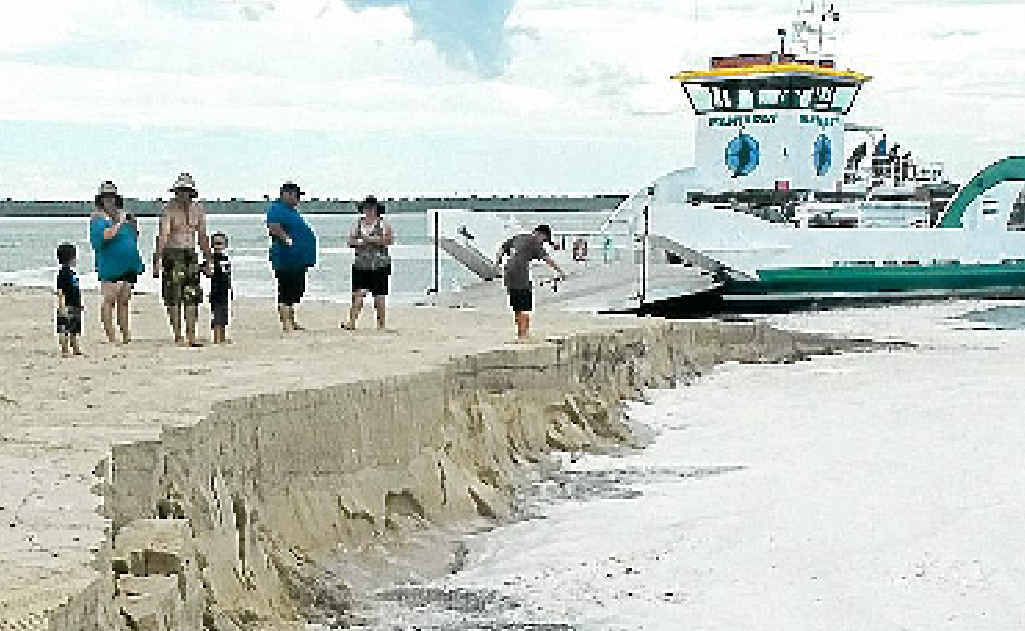 The barge landing area at Inskip Point on Tuesday afternoon caved in just minutes after cars were loaded on to waiting barges. The barge landing area at Inskip Point on Tuesday afternoon caved in just minutes after cars were loaded on to waiting barges.